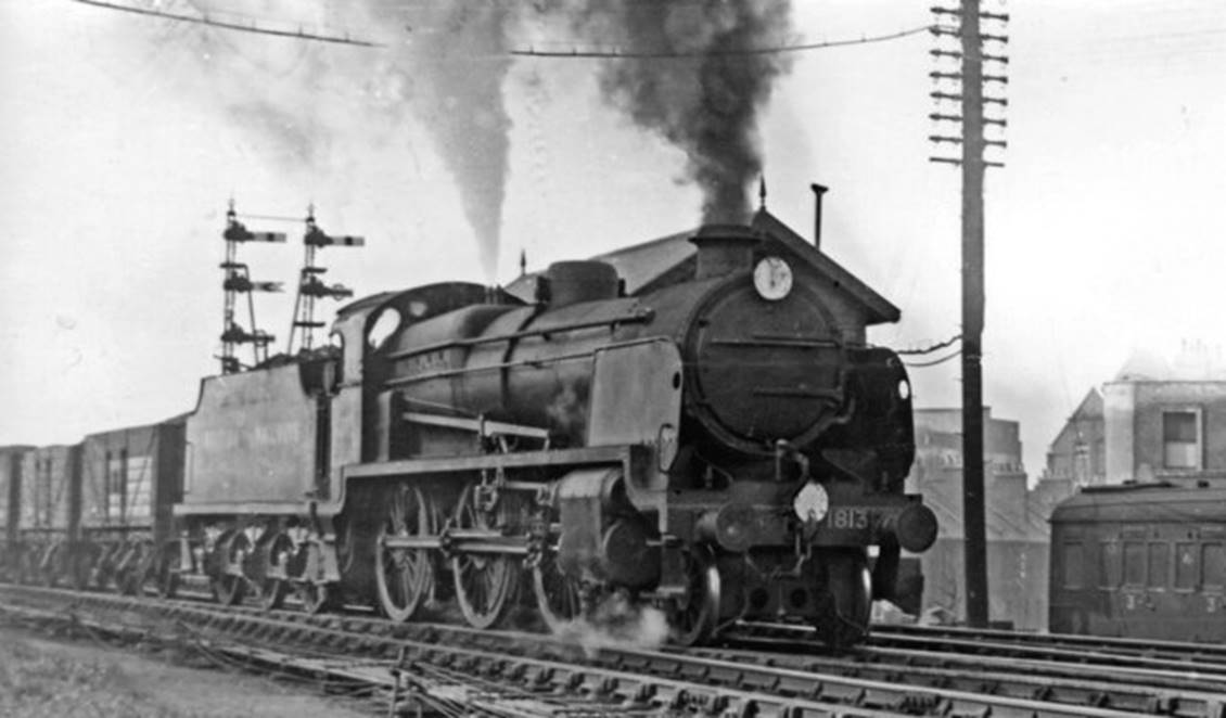 View westward, towards Bricklayer's Arms Depot; ex-SECR & LBSCR branch. The train is headed by SECR Maunsell N class 2-6-0 no. 1813 (built September 1920, withdrawn October 1963); here on 10th March 1948 it has not yet been renumbered 31813 but has 'British Railways' on the tender.
 Ben Brooksbank (Geograph/CC-by-SA)
