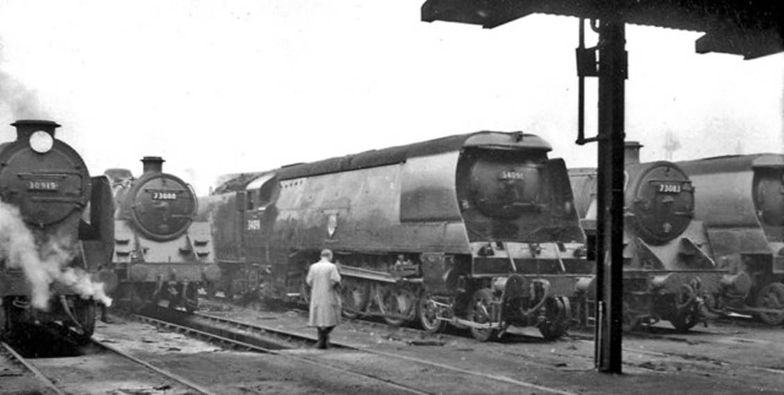 Line-up of locomotives at Stewarts Lane Locomotive Depot for an RCTS visit on Saturday, 15th February 1958 
Looking north out of the main 16-road terminal Shed on the left is Maunsell V-class 'Schools' no.30919 'Harrow' (built June 1933, fitted with Lemaitre chimney February 1941, withdrawn January 1961).
In the centre is air-smoothed Bulleid Light Pacific no. 34091 'Weymouth' (built September 1949, withdrawn September 1964) and far right is no. 34097 'Holsworthy' (built November 1949, rebuilt later  March 1961, withdrawn April 1967).
In between the Southern locomotives are two BR Standard 5MT no.73088 (built September 1955, withdrawn October 1966) and 73083 (built July 1955, withdrawn September 1966).
Subsequently (in 1959-61) these respectively acquired names 'Joyous Gard' and 'Pendragon' from former Urie 'King Arthur' N15-class locomotives.
 Ben Brooksbank (Geograph/CC-by-SA)
