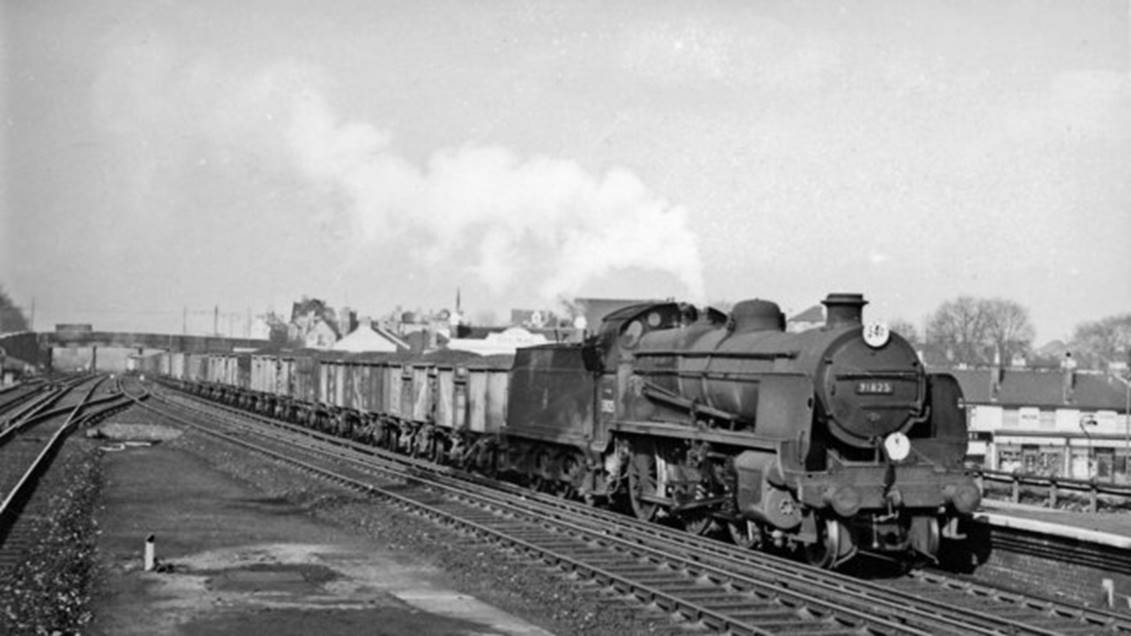 Norwood Locomotive Depot was located just beyond Goathouse Road skew bridge in the distance. On 2nd April 1958 Maunsell N-class no.31825 (built December 1923, withdrawn October 1963) hauls a coal train on the Down Slow line through Norwood Junction station. The disc-code indicates that it had come from Hither Green Sidings (which was a long way round)!
 Ben Brooksbank (Geograph/CC-by-SA)
