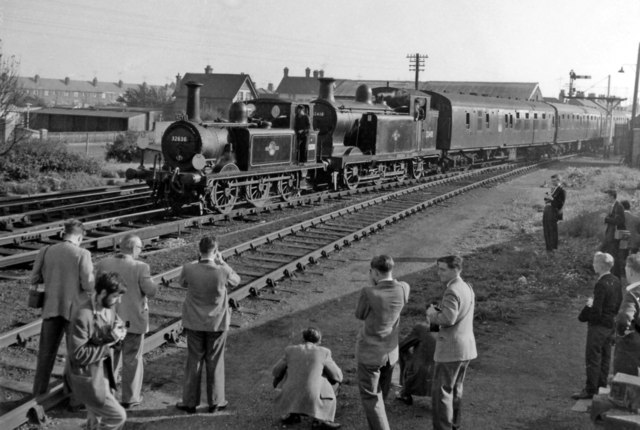 Sunday, 7th October 1962 and The Railway Correspondence & Travel Society 'Sussex Rail Tour' train, with its A1X no. 32636 & E6 no.32418 hauling ex-’Man of Kent’ Mk1 set 279, is pulling into Newhaven Town station to pick up the tour passengers after they had visited the Shed.
© Ben Brooksbank (Geograph/CC-by-SA)
