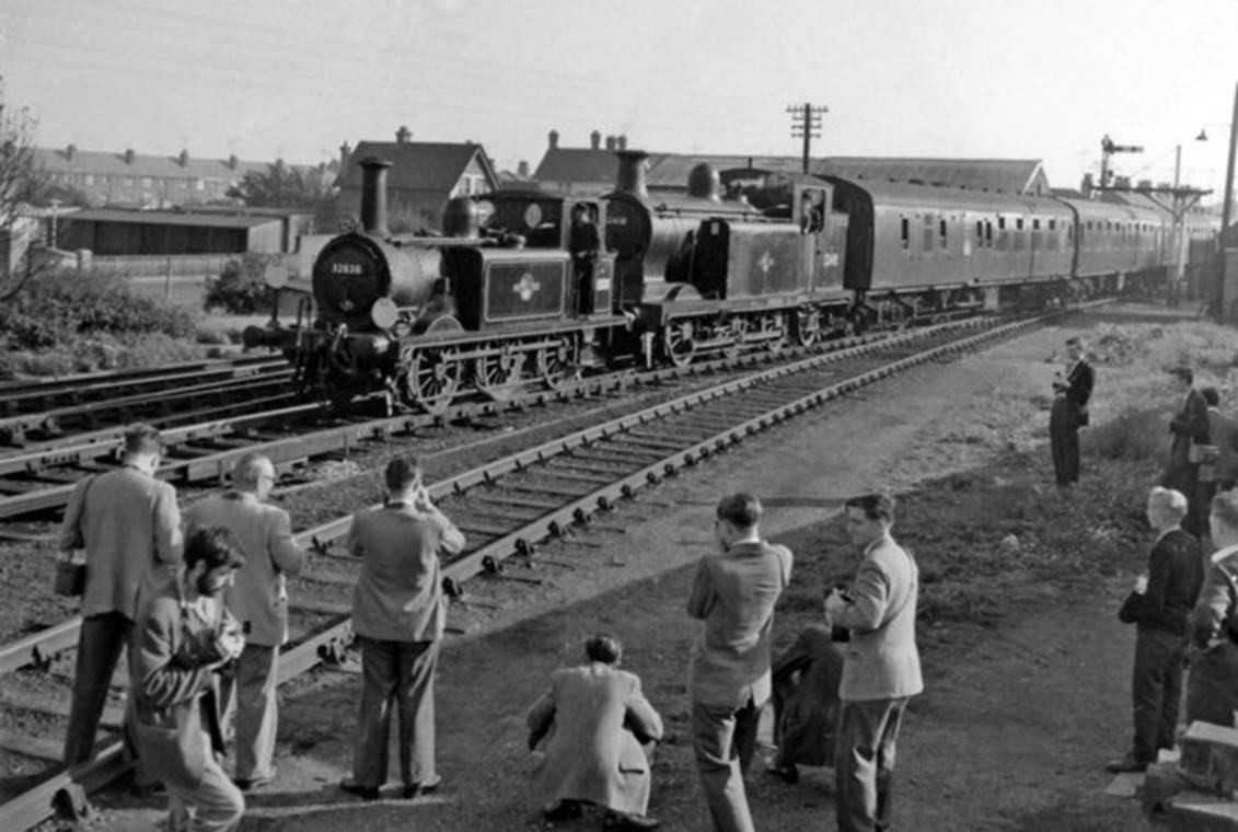Sunday, 7th October 1962 and The Railway Correspondence & Travel Society 'Sussex Rail Tour' train, with its A1X no. 32636 & E6 no.32418 hauling ex-’Man of Kent’ Mk1 set 279, is pulling into Newhaven Town station to pick up the tour passengers after they had visited the Shed.
© Ben Brooksbank (Geograph/CC-by-SA)
