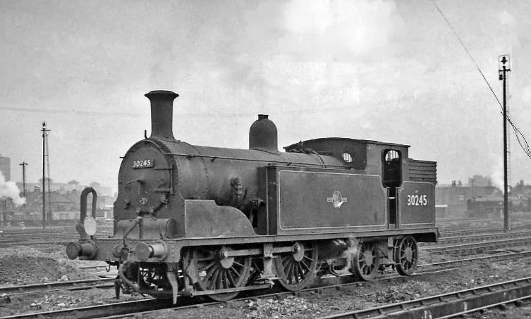 www.BloodandCustard.com
Ex-LSWR Drummond M7 class no. 30245 (built April 1897, withdrawn November 1962 but preserved in the National Collection at York) is seen in the yard of this large and famous Depot, which served the passenger trains from Waterloo and freight trains from Nine Elms Goods. It adjoined the latter to the south of the main lines, south of Vauxhall. In the 1950s the Depot had an allocation of nearly 100 steam locomotives of all types and it remained active until the end of steam working into Waterloo in July 1967, after which the New Covent Garden Market was built over the site.
 Ben Brooksbank (CC-by-SA/2.0)
