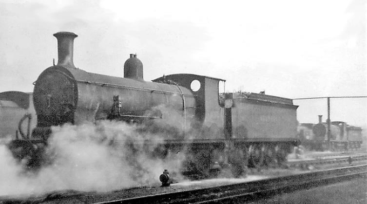 www.BloodandCustard.com
Wintry scene in Nine Elms Locomotive Yard, with ex-LSWR Drummond L11 class no.437 (built December 1906, withdrawn April 1952) was latterly used for 'odd jobs' - local goods etc. 
Nine Elms Depot was hidden from the main lines out of Waterloo on the Down (east) side south of Vauxhall. It lasted until the End of Steam, being closed on 9the July 1967, then soon demolished and replaced by the New Covent Garden Market. But in 1946 it had an allocation of 107 steam locomotives - 10 off 4-6-2, 37 off 4-6-0, 17 off 4-4-0, 5 off 2-6-0, 5 off 0-6-0, 1 off 0-8-0T, 10 off 0-6-0T, 19 off 0-4-4T and 3 off 0-4-2T, a motley collection of 18 different classes.
 Ben Brooksbank (CC-by-SA/2.0)
