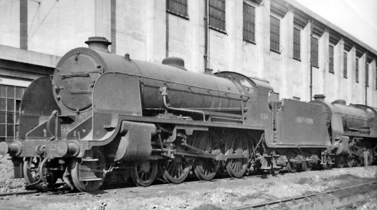 www.BloodandCustard.com
Outside the main Shed on 27th September 1947 are two of the later (Maunsell) S15 class locomotives, used for many of the main-line freight workings from Feltham Yard. The front one is no.834 (built November 1927, withdrawn November 1964), behind is no.837 (built January 1928, withdrawn September 1965).
 Ben Brooksbank (CC-by-SA/2.0)
