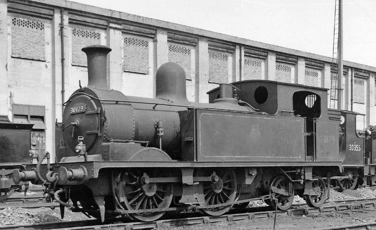 www.BloodandCustard.com
Ex-LSWR Adams class O2 no.30179 was built March 1890 and withdrawn December 1959. Normally employed on branch lines (notably in the Isle of Wight) this one at Feltham was used just for 'odd jobs', no doubt (11th May 1959).
 Ben Brooksbank (CC-by-SA/2.0)
