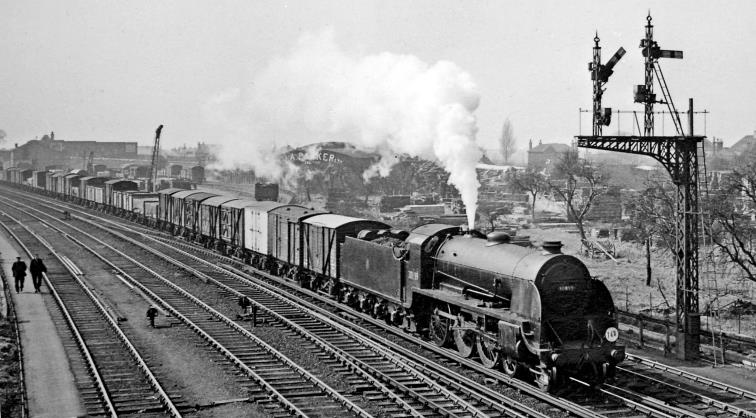 www.BloodandCustard.com
Up freight approaching Feltham Marshalling Yard on 1st April 1958, having passed through Feltham station on the Windsor Lines to Clapham Junction. The locomotive is Maunsell class S15 no.30839 (built May 1936, withdrawn September 1965).
 Ben Brooksbank (CC-by-SA/2.0)
