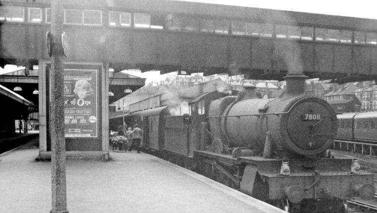 www.BloodandCustard.com
Ex-GW locomotives were not unusual at Guildford, working from Reading (South) on the ex-SECR line. No.7808 'Cookham Manor' on a stopping train from Redhill to Reading waits against platform 8 for mail to be loaded (built March 1938, withdrawn December 1965 and preserved).
 Ben Brooksbank (CC-by-SA/2.0)
