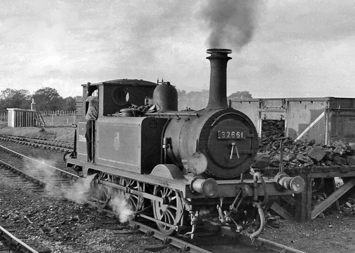 10th May 1958
At the 'Locomotive Depot', one of the ancient ex-LBSCR A1x class  Terrier  is being coaled ready for its return to Havant. These owed their survival to being the only engines light enough to cross the Langstone Bridge on the Branch. 
No. 32661 was built as an A1 by Stroudley (number 61 'Sutton') in October 1875, rebuilt to A1x in January 1912 and survived until April 1963. Note the spark-arrestor.
  Ben Brooksbank (CC-by-SA/2.0)

