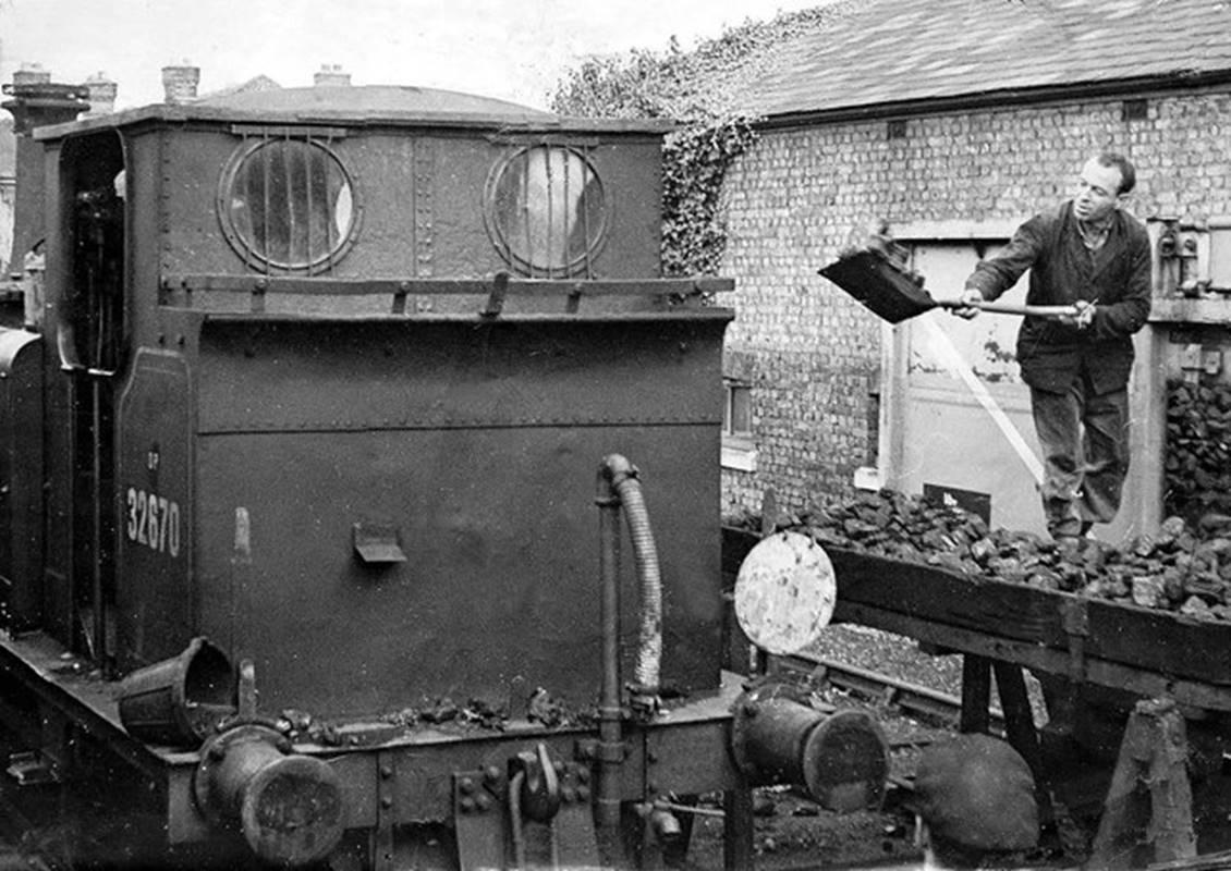 3rd August 1963
The glamour of steam? - not as far as this fireman was concerned!
The reality of manual coaling of the A1x tank locomotives was the order of the day at Havant for operation of the Hayling branch line and was probably done this way at Havant since the line opened in 1865.
 John Lucas (CC-by-SA/2.0)
