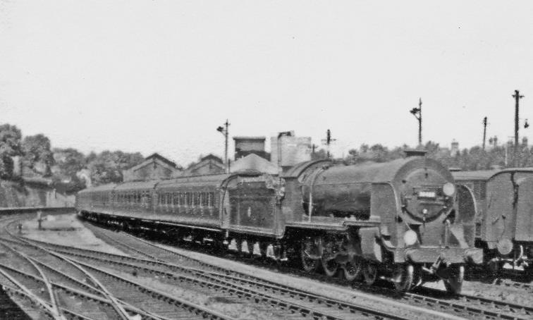 Weymouth train entering Bournemouth Central on 16th June 1951 passing Bournemouth Locomotive Depot and headed by ex-LSWR Urie H15 no.30489 (built May 1914, withdrawn January 1961)..
  Ben Brooksbank (CC-by-SA/2.0)
