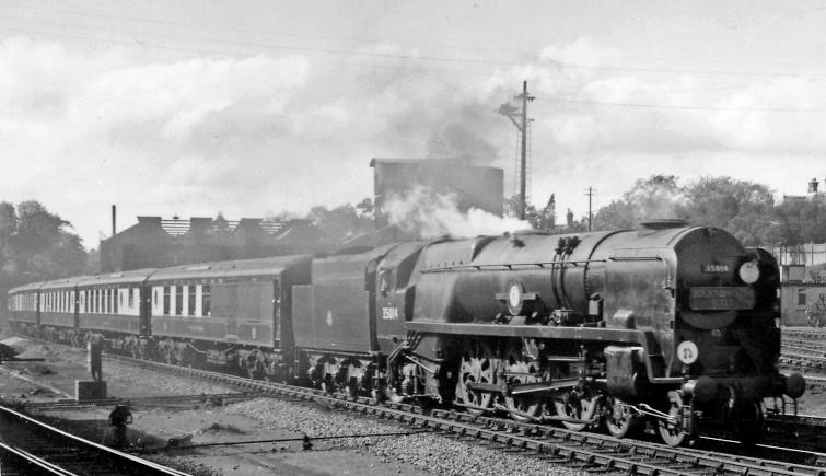 Up Bournemouth Belle entering Bournemouth Central on 10th May 1958. This crack Pullman express ran seven days a week, leaving Bournemouth West at 4.30pm, left Central and then called only at Southampton, due at Waterloo at 6.49pm. The locomotive this day is rebuilt Bulleid 'Merchant Navy' no.35014 'Nederland Line' (built February 1945 as no.21C14, renumbered May 1949, rebuilt July 1956, withdrawn March 1967). Bournemouth Locomotive Depot is just behind the train.
© Ben Brooksbank (CC-by-SA/2.0)
