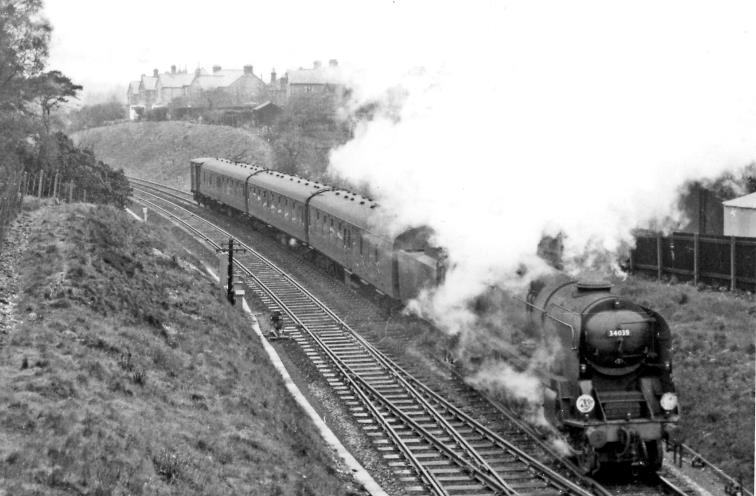 In pouring rain on Saturday, 20th April 1963, the 12.10pm Weymouth - Bournemouth train approaches Branksome. Headed by rebuilt Bulleid Light Pacific no.34039 'Boscastle' (built September 1946 as no.21C139, renumbered July 1948, rebuilt January 1959, withdrawn May 1965 thence preserved.
  Ben Brooksbank (CC-by-SA/2.0)

