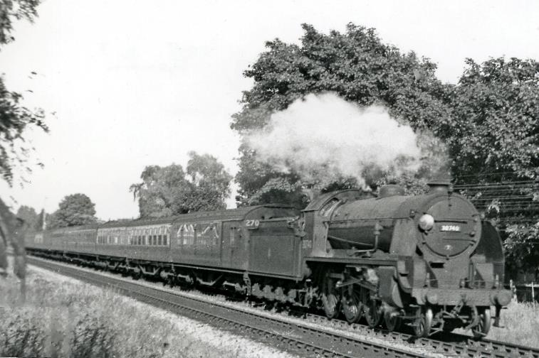Down empty stock between Branksome and Parkstone on 16th June 1951. The train is headed by ex-LSWR Urie 'King Arthur' class N15 no.30740 'Merlin' (built March 1919, withdrawn December 1955).
The first five coaches a 5-Cor set 270 in post-War Malachite; the set being outshopped Crimson Lake on Cream in 1954.
  Ben Brooksbank (CC-by-SA/2.0)
