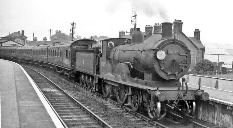 At Poole on 5th July 1958 the 12.50 Eastleigh to Wimborne (Down) stopping train is headed by ex-LSWR Drummond T9 class no.30289 (built February 1900, withdrawn December 1960).
 Ben Brooksbank (CC-by-SA/2.0)
